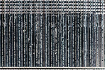 Background and texture of iron nails for a pneumatic nail gun, closeup, top view. Abstract surface of carpenters nails