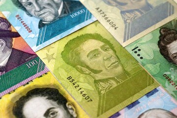 Venezuelan Bolivar currency money bills in big amount. Heap of VED currency banknotes with different denomination close up © mehaniq41