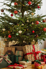 Beautifully decorated Christmas tree with ornaments and wrapped