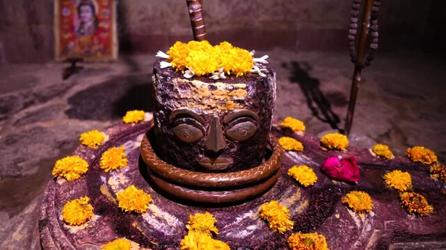 Shivling in temple decorated with flowers. Hindu god lord shiv.