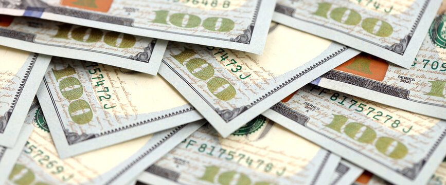 United States Dollar currency money bills. USD currency banknotes in stack with different denomination close up