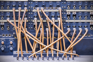 Vintage telecommunications telephone switchboard with connected wires