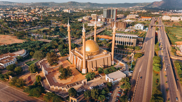 Fototapeta Aerial view of the majestic National Mosque's golden dome and minarets rise above the lush greenery near Sani Abacha Way, Abuja, Federal Capital Territory, Nigeria.