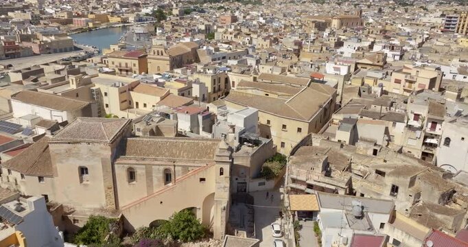 Aerial view of houses and buildings in the historic center of Mazara del Vallo, in the province of Trapani, Sicily, Italy. It's a beautiful sunny day.
