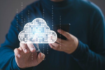 Person touching virtual cloud icon with binary code, representing cloud computing, online data storage, digital network, information technology, and modern innovation in data management systems.