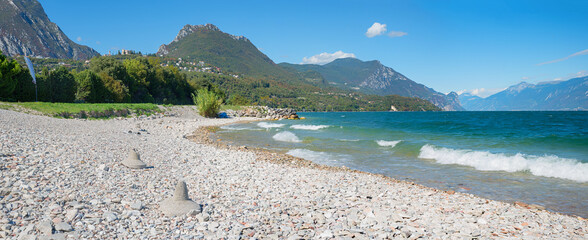 bathing beach Toscolano-Maderno, with gravel stones. lake shore Gardasee italy