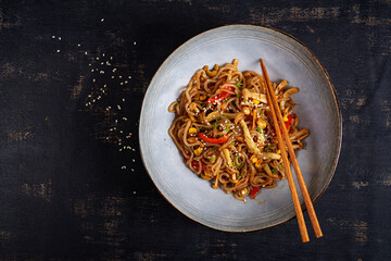 Shirataki noodles stir-fried in spicy soy sauce. Shirataki noodles with shimeji mushrooms. Asian cuisine. Top view.