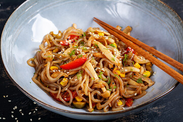 Shirataki noodles stir-fried in spicy soy sauce. Shirataki noodles with shimeji mushrooms. Asian cuisine.