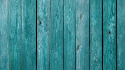 Obraz premium Close up view of painted teal wooden planks with visible grain and texture arranged vertically to form a weathered fence or wall surface