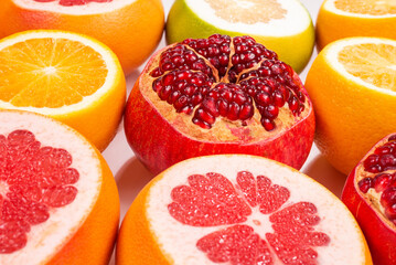 Grapefruit, orange, pomegranate, citrus sweetie on white background.