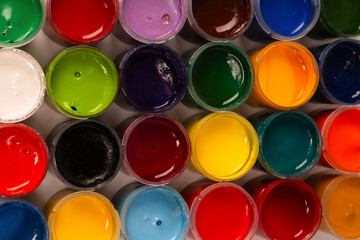 Gouache colorful paints set. Jars of gouache paint isolated on a white background.