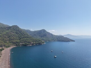 Obraz premium Tranquil Aegean Coastline and Crystal Blue Waters