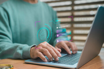 A person using a laptop with a digital fingerprint scan and virtual login interface, symbolizing cybersecurity, data protection, identity verification, and secure online access technology.