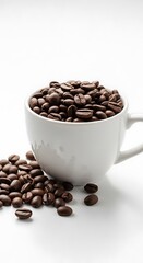 Coffee Beans Overflowing from a White Mug on a White Surface.