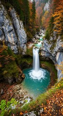 Majestic Waterfall Cascading into a Turquoise Pool in Autumn.