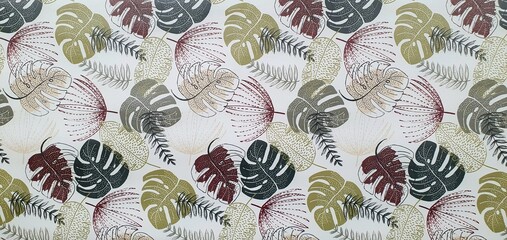 Texture of wallpaper or fabric with an ornament of colored palm leaves on a white background. Print with palm leaves ornament. Exotic background ornament. Interior design wallpaper. Fashion design.	