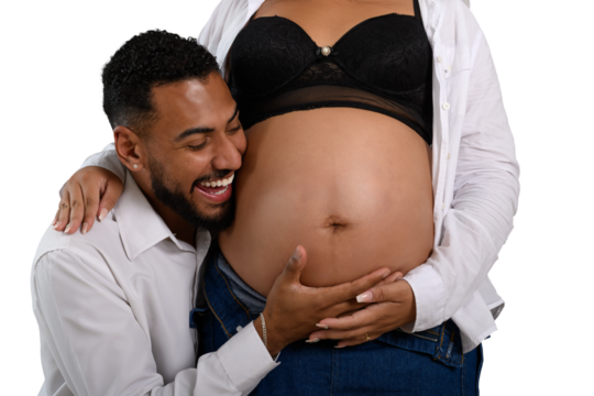 Happy dad listens to his pregnant partner's belly. - Powered by Adobe