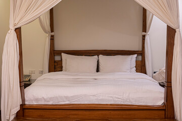 canopy bed with white curtains