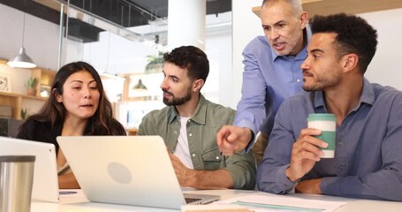 Diverse coworking team collaborating on project in modern office - Powered by Adobe