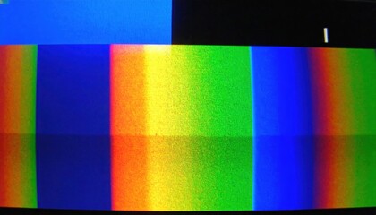 Vibrant rainbow color bands on a television screen with a pixelated glitch effect.