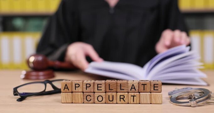 Examining justice at the appellate court with focused minds and important documents in the background
