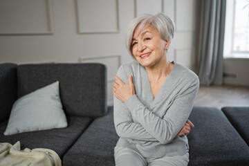 Portrait of confident stylish european middle aged senior woman. Older mature 60s lady smiling at home. Happy attractive senior female looking camera close up face headshot portrait. Happy people