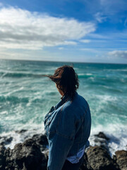 Young woman with sunglasses enjoying a sunny day on Fuerteventura beach