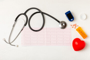 Medical stethoscope, red heart, and cardiogram on a color background. ECG, Heart wave, heart attack, cardiogram report. Cardiogram pulse trace and heart concept. Healthcare.Space for text