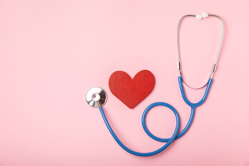 Medical stethoscope, red heart, and cardiogram on a color background. ECG, Heart wave, heart...