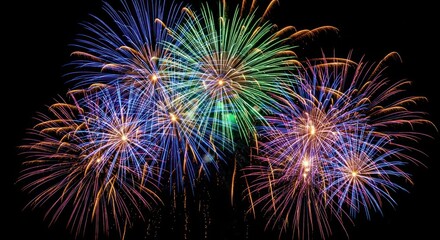 Vivid fireworks burst against a dark night sky, showcasing dynamic colors and intricate patterns. Explosions illuminate the background
