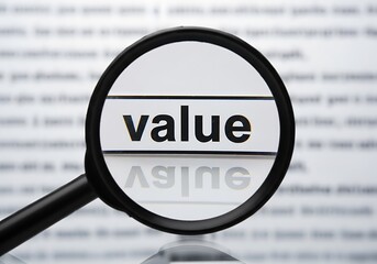 Magnifying Glass Focusing on the Word Value Printed on Text