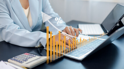 Business growth and financial data analysis with increasing bar chart and person working on laptop