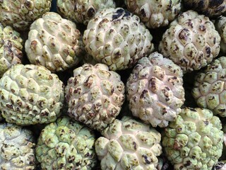 Close up shot of pile of fresh custard apple or sarifa open sell in Indian market.