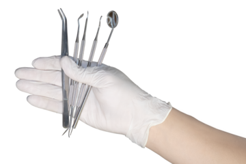 Detail of hand holding dental tools on transparency background.