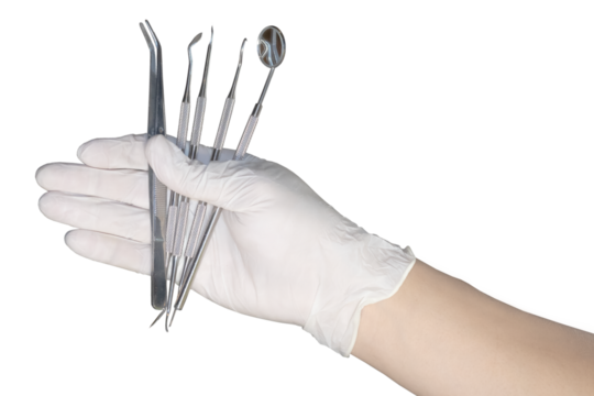 Detail of hand holding dental tools on transparency background.