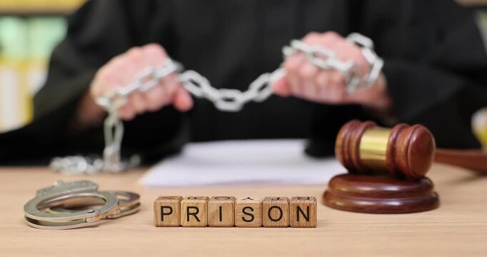 Courtroom drama unfolds as judge handles chains and gavel in an intense legal moment