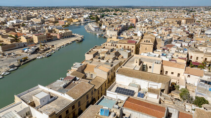 Aerial view of the Mazaro River, which bisects the city of Mazara del Vallo, in the province of Trapani, Sicily, Italy. The town's historic center is located on the banks of the river.
