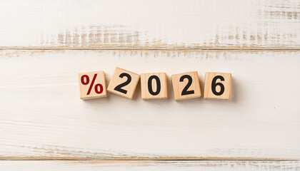 Wooden Blocks Showing Percent Symbol and 2026 on White Rustic Background for Finance Concepts