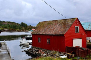 Traditional Red Boathouse and Fishing Boats in Forland, Sotra, Norway