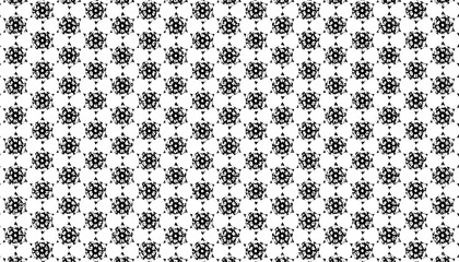 Black and white repeating intricate geometric star-like pattern