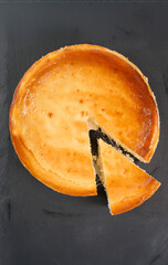 Cheesecake tart with a slice cut serving dessert