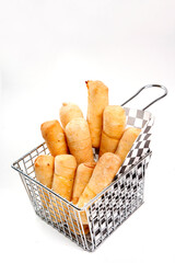 Fried tequeños cheese sticks in metal basket