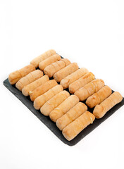 Tequeños venezuelan cheese finger snacks on slate platter