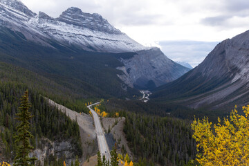 Scenic road toward snowy peaks on Icefields Parkway in Alberta