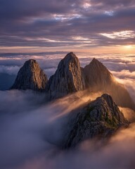 Misty Mountain Peaks At Sunrise