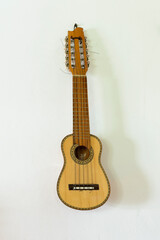 Obraz premium Charango Latin Musical Instrument on a white wall