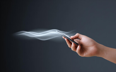 Mysterious hand holding smartphone with smoke wave signal. glowing representation of data communication, future technology, and wireless connection online