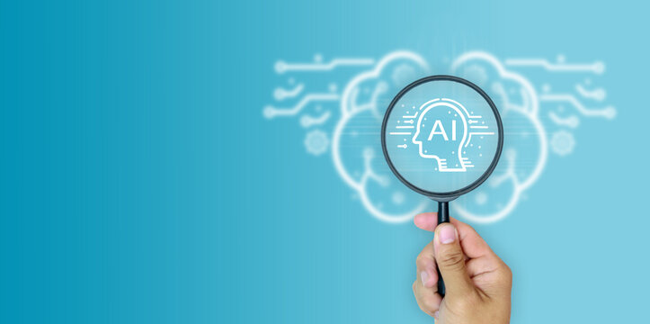  Hand holding magnifying glass focused on AI head icon with blurred background of digital brain symbolizing artificial intelligence, technology innovation, data analysis for simple banner and web.