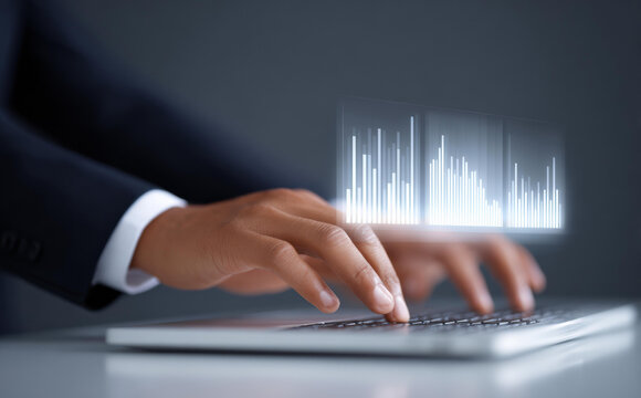 Focused businessman hand typing on laptop with technology data analysis chart. professional man working on computer for business finance and stock market investment
