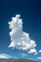 Tall Cloud Drifts Across Ridge In Rocky Mountain